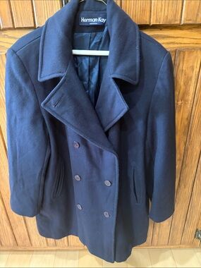 The Herman Kay wool blend Navy blue 
Peacock design size  14